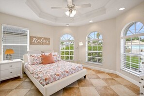 This spacious home can comfortably sleep up to 10 guests. This is one of our bedrooms with a queen-sized bed.