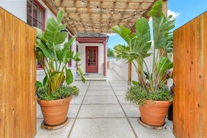 The available dedicated parking space and coded entrance are located on Spanish St.