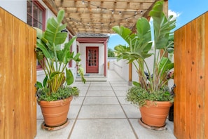 The available dedicated parking space and coded entrance are located on Spanish St.