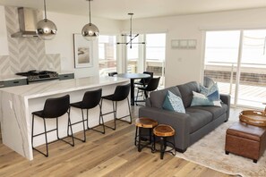 The main room is a great gathering place to enjoy a meal, watch TV, or watch the sunset!