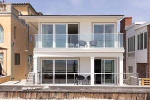 You are steps away from the sand in this stunning, highly upgraded beach front home!