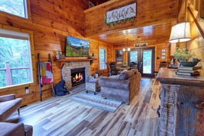 Open concept living and dining room.  65" FireTV and gas fireplace.