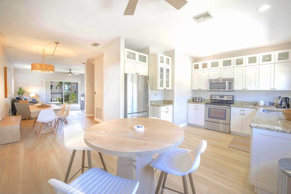Large kitchen and living area flows into ocean-view balcony, Siesta Key 3BR