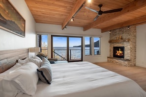 Bedroom 2 with King bed, fireplace, and en-suite, and deck access (1st floor)