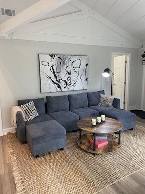 Relax in this coastal chic living room with 50 in Smart TV and Cable. Free WiFi.
