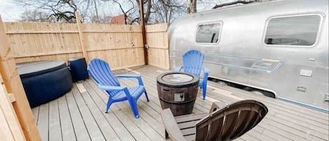 Enjoy the private deck with hot tub, fire pit and grill. 