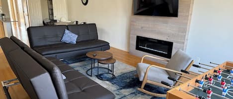 Wide open living room w/ smart TV and Cozy fireplace