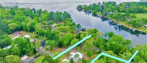 Over 2.4 acres is yours with 210' of lake frontage with kayaks, canoe, firepit