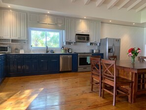 An expansive kitchen is part of the Great Room.