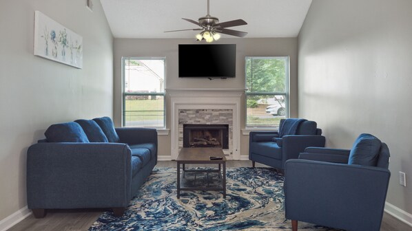 Relax, get comfortable and enjoy family and friend time in the large living room