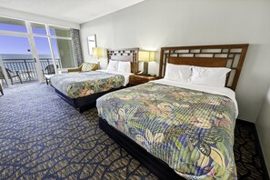 - Elegant bedroom with two queen sized beds offer a cozy retreat with soft linens for restful nights - Wake up to ocean views from your private balcony, a perfect morning escape - Relax in a stylish space with warm lighting & a peaceful beach vibe