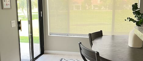 Dinning room off the Kitchen with views of the golf course. 