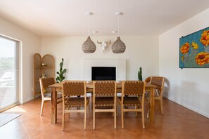 Gorgeous live edge teak dining table with seating for 8.