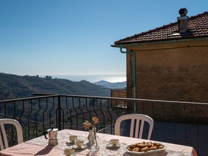 Sky, Cloud, Food, Plant, Tableware, Table, Window, Mountain, Fruit, Wood