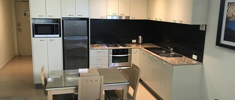 Full kitchen with gas cook top, oven, DW, Fridge microwave.