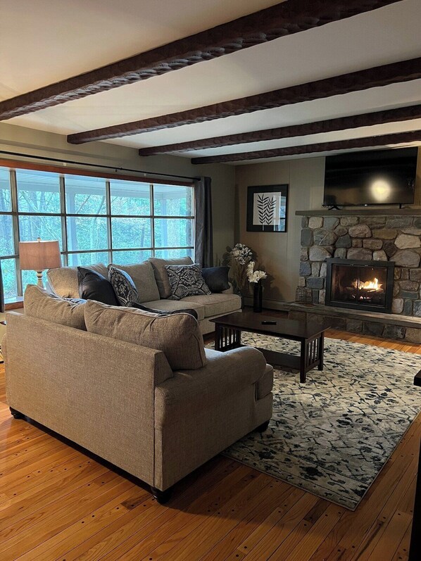 Upstairs living room.  Smart TV,  fireplace