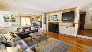 Living room with comfortable seating and flat screen TV