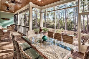 Screened-in back porch with dining for 8
