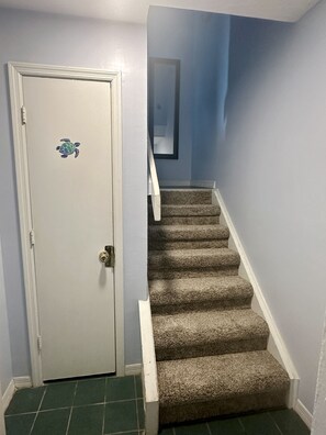 Entry, closet full of beach stuff. Up the steps to the main living area.