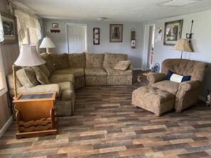 Living room with Ethan Allen sectional sofa with down pillows and lamps& chair.