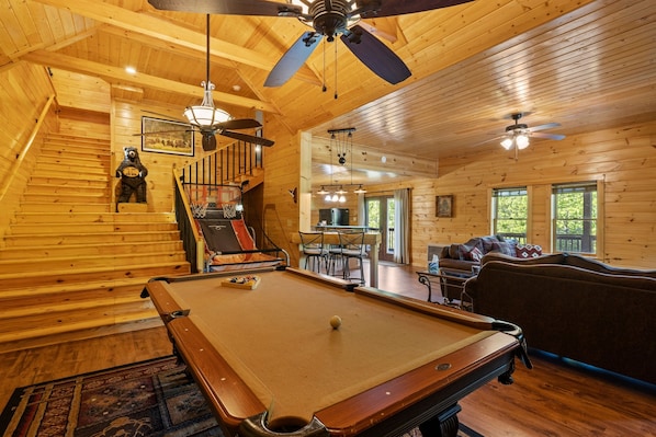 Huge game room with Pool Table, Basketball, TV, Poker Table, and 2 Arcade Cabinets!
