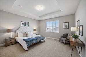 Upstairs master suite with a king bed.