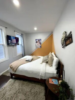 Welcome to our spacious bedroom, thoughtfully designed for comfort and productivity. Two cozy beds provide ample sleeping space, perfect for family or friends. A well-equipped work station offers a dedicated area for focus and creativity. Whether you're unwinding or working, this versatile bedroom ensures a restful and productive stay.

