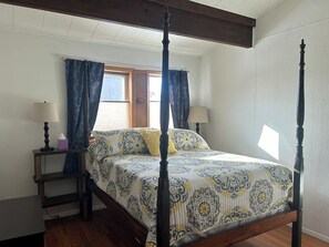 Queen size bed, TV and blackout curtains