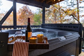 Enjoy ultimate relaxation in our private hot tub, a premier amenity.