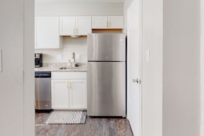 Adorable kitchen, extremely well stocked to make a serve a meal