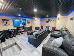 Brand New Awesome Home Theater/Game Room with a Huge Smart TV & pullout sleeper