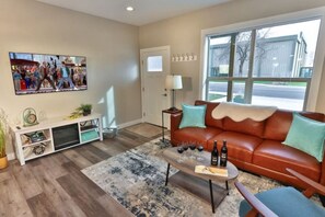 Main floor living room with TV