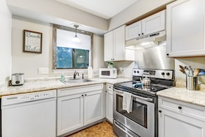 Bright White Cabinets and Light Filters in from Window