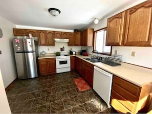 Kitchen has large counter tops for prepping. Programable coffee maker and more. 