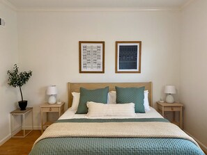 King bed with memory foam mattress. Charging stations on nightstands.