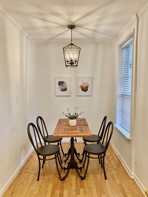 Comfortably seat four in the dining area overlooking the neighborhood.