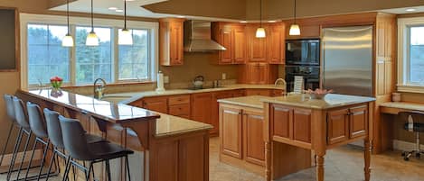 Bright kitchen with lots of counter space and seating for 15