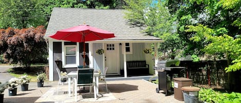 The front door leads to a porch, patio, and small yard. 