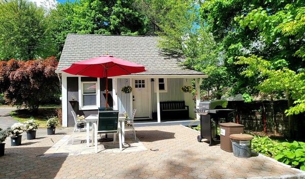 The front door leads to a porch, patio, and small yard. 