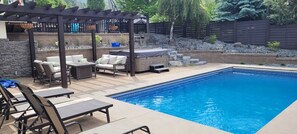 Gorgeous heated pool, hot tub, fire table with coaches four sun bathing chairs. 
