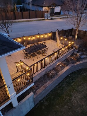 Upper patio with beautiful table with seating for 8.  Grass is now pool.