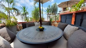 9 person dining table on shared terrace. A great place to eat, drink, and relax.