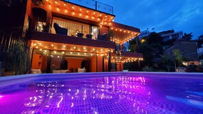 Villa at night. Top left: Ivan's Bella Vista, Bottom left: Curiel's Retreat