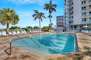 When you're not at the beach, enjoy the Florida sun in the heated community pool with paved sundeck