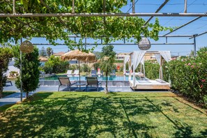 A natural shaded are next to the pool for cherishing a summer breeze. 