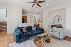 Open living room area w/ easy access to kitchen and dining areas