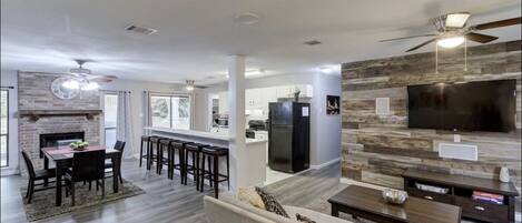 Big, open, entertainment-style living room and Kitchen.