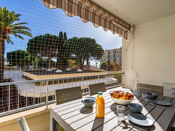 Table, Property, Tableware, Furniture, Food, Sky, Building, Plant, Shade, Chair