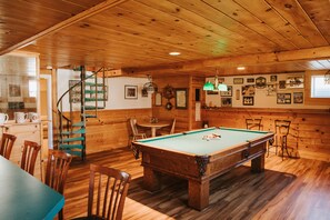 Game room with beautiful pool table and wet bar.