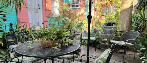 Your private patio with umbrella and furniture.  (Door to your cottage, too!)